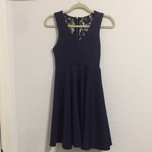 Dark blue dress with black lace details on back